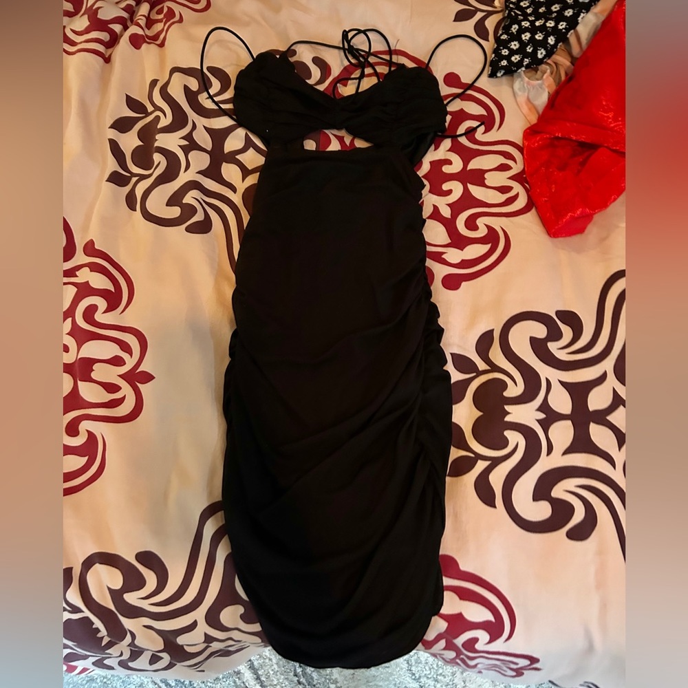 This is a black mini party dress.